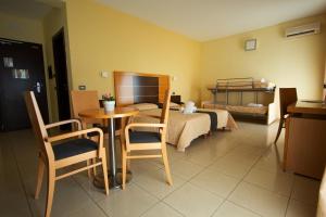 Posezení v ubytování Ticho's Greenblu Hotel