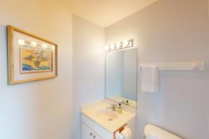 a white bathroom with a sink and a mirror at Poetry in Motion #7-K in Avon +32 photos