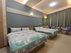 Postelja oz. postelje v sobi nastanitve Nice Neighbors Homestay