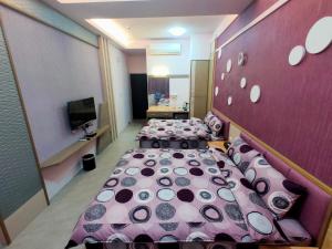 Postelja oz. postelje v sobi nastanitve Nice Neighbors Homestay
