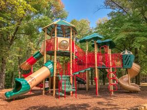 a playground with a slide and a slideintend at Sun Outdoors Lake Rudolph in Santa Claus