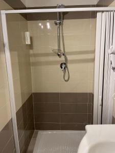 a shower in a bathroom with a toilet at Station's Room in Avellino