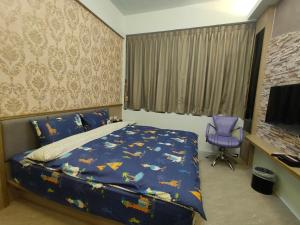 Postelja oz. postelje v sobi nastanitve Nice Neighbors Homestay
