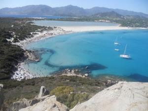 an aerial view of a beach with boats in the water at Casa Relax in Villasimius
