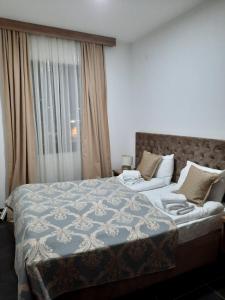 Postel nebo postele na pokoji v ubytování Zlatibor Hills Lux Apart MN + 10 fotografií