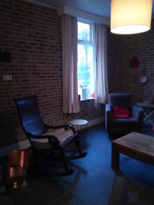 Posezení v ubytování Vakantiehuis In het Voorhuis