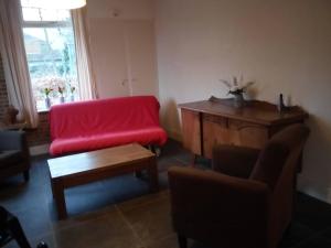 Posezení v ubytování Vakantiehuis In het Voorhuis