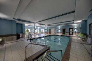 a large swimming pool in a large building at Holiday Inn Express Hotel & Suites Oklahoma City-West Yukon, an IHG Hotel in Yukon