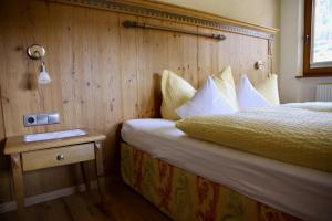Łóżko lub łóżka w pokoju w obiekcie Landhaus Gotthard