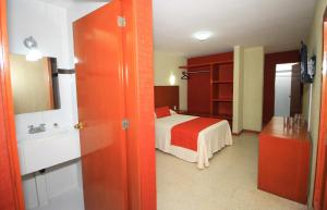 Postel nebo postele na pokoji v ubytování Hotel Central