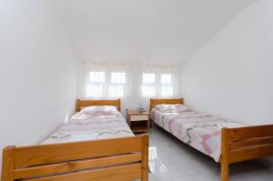 Postel nebo postele na pokoji v ubytování Apartments Slobodanka