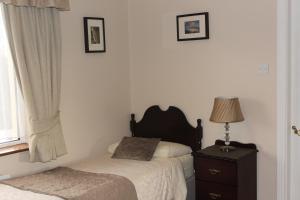 Letto o letti in una camera di Dunross House B&B