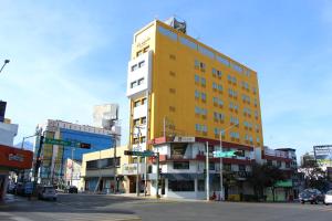 a yellow building on the corner of a city street at El Regio in Monterrey