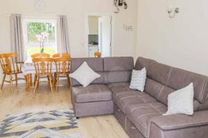 a living room with a couch and a table at John & Margarets Place in Ballinamore