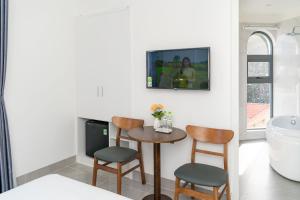 TV a/nebo společenská místnost v ubytování Sun Hill Hotel