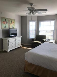 a bedroom with a bed and a flat screen tv at Holiday Inn Club Vacation Galveston Seaside Resort in Galveston