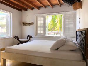 Een bed of bedden in een kamer bij Secreto Hostel