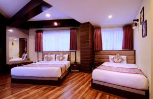 Postel nebo postele na pokoji v ubytování Zambala Retreat & Spa Darjeeling