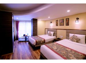Postel nebo postele na pokoji v ubytování Zambala Retreat & Spa Darjeeling