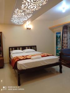 Voodi või voodid majutusasutuse Cauvery Homestay toas