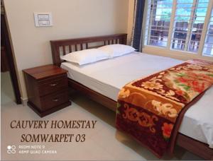 Postel nebo postele na pokoji v ubytování Cauvery Homestay