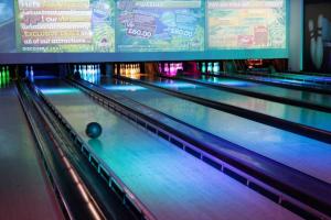 a row of bowling lanes with a ball on the lane at Great Deals at The Grange, Ingoldmells in Skegness