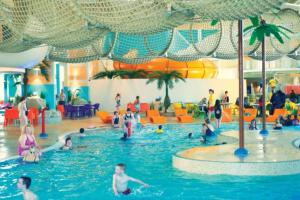 a group of people in a pool at a water park at Great Deals at The Grange, Ingoldmells in Skegness