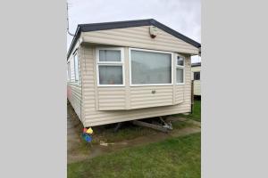 a tiny house on a trailer in a yard at Great Deals at The Grange, Ingoldmells in Skegness