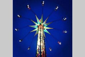 a ferris wheel with people riding on it at Great Deals at The Grange, Ingoldmells in Skegness