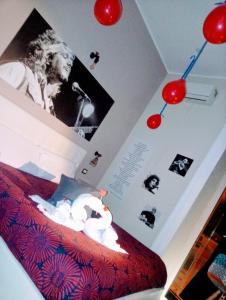 Ένα ή περισσότερα κρεβάτια σε δωμάτιο στο Artisti Bed&Dreams