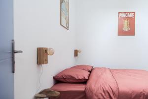 Ένα ή περισσότερα κρεβάτια σε δωμάτιο στο L’Intemporel 40