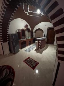 a large kitchen with an archway in a house at Oriental house in Luxor