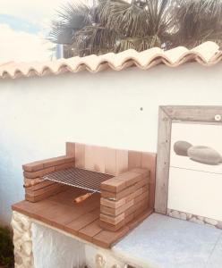 a grill on top of a wooden deck at El Lagar de los Abuelos in Arcos de la Frontera