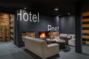 Posezení v ubytování Unique Hotel Post