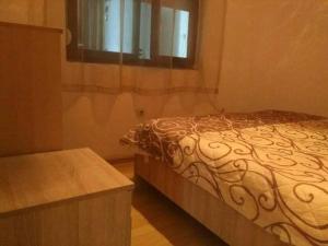 a bedroom with a bed and a window at Apartments Filemi in Ohrid