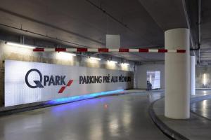 a parking garage with a sign on the wall at Les Remparts Antibes Location in Antibes