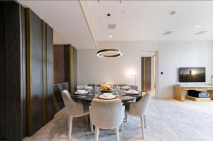 a dining room with a table and chairs at Five Palm Residences Dubai - 2BR Fully Furnished in Dubai