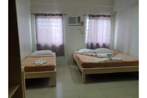 Postel nebo postele na pokoji v ubytování LOC Residence Inn