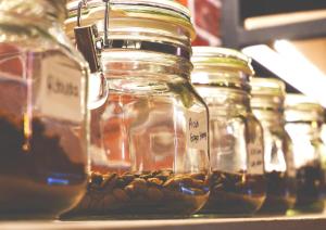 a group of jars of honey on a shelf at Hadi Park in Surabaya