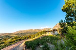 a house on the side of a dirt road at Amberg Country Estate in Paarl