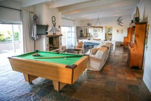 a living room with a pool table in it at Brander View in Hermanus