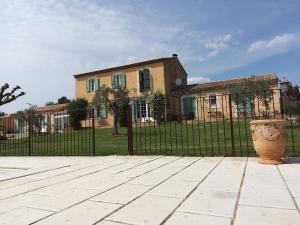 a wrought iron fence in front of a house at Gite La RESTANCO in Mouriès