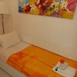 A bed or beds in a room at NN Luxury Apartment near Athens airport