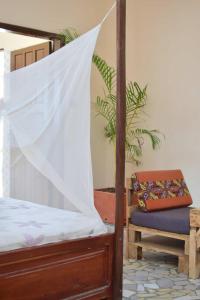 Katil atau katil-katil dalam bilik di Akwa Guesthouse Cotonou