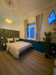 En eller flere senge i et værelse på Capstay Roubaix Lille private shower & Netflix