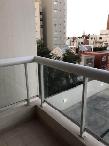 a balcony with a view of a city at Arenas- Departamento de playa in Puerto Madryn