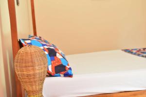 Postel nebo postele na pokoji v ubytování Akwa Guesthouse Cotonou