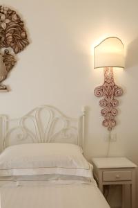 En eller flere senge i et værelse på Badia Vecchia Apartment