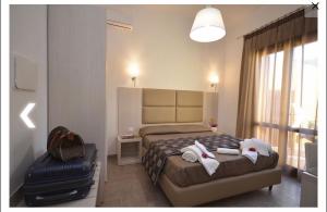 Postel nebo postele na pokoji v ubytování B&B Timpe Bianche