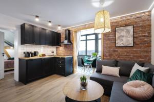 Kuchyňa alebo kuchynka v ubytovaní Apartamenty AstoriA